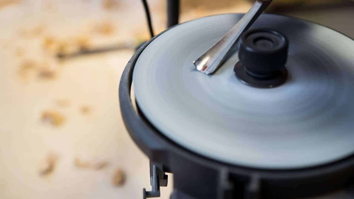 Gouge held against a spinning grinding disc