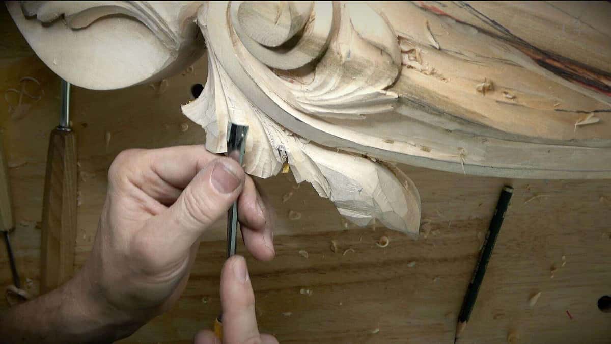 Setting in the outline of an acanthus lobe, spare gouges waiting behind the cut