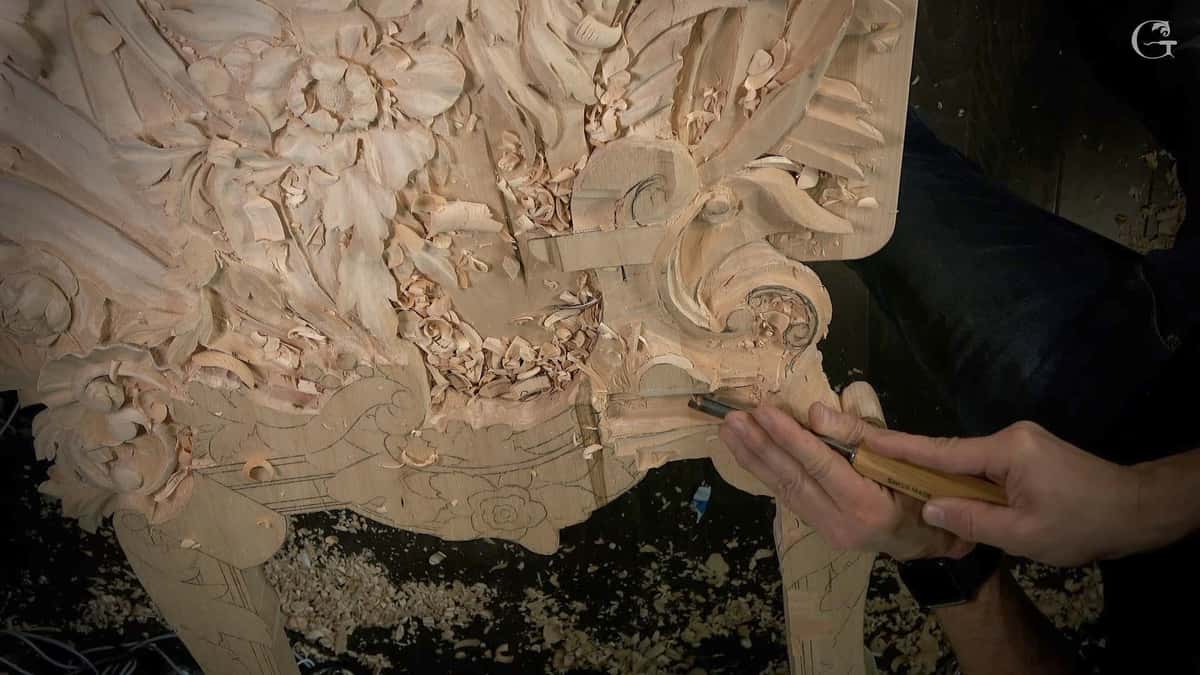 Detailing a volute at the edge of a flowered panel