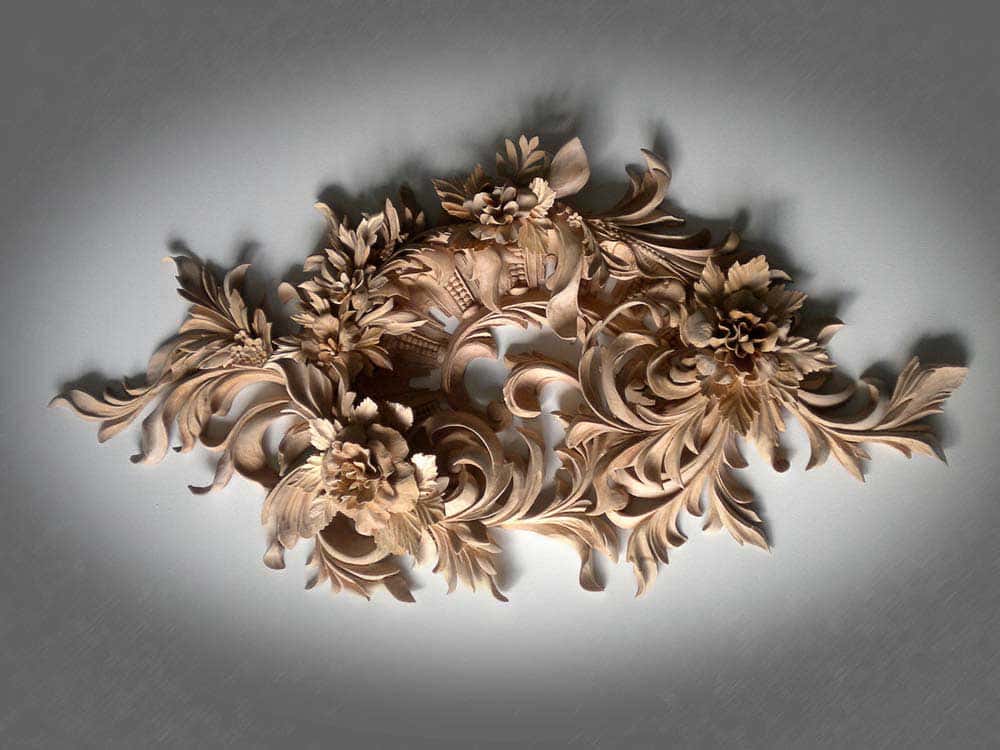 A finished wall panel of peonies and acanthus, lit against grey