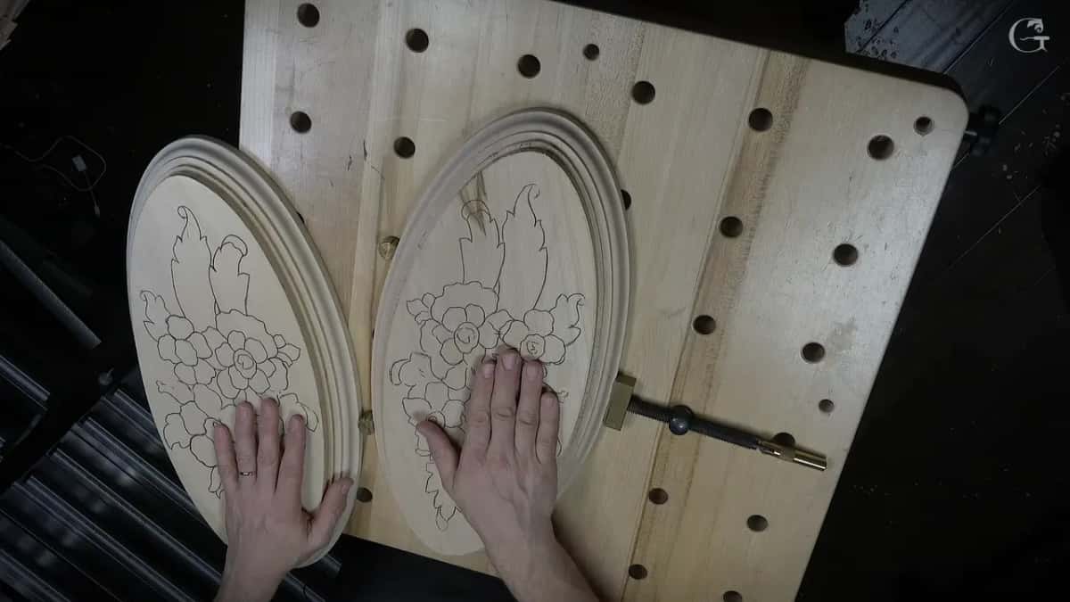 Two oval pale blanks side by side, the same flower pattern traced on each.
